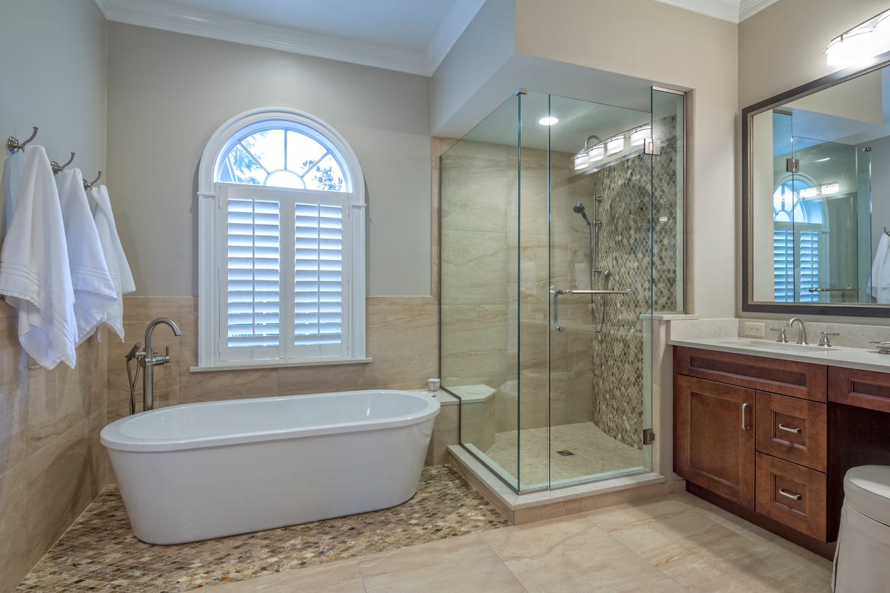 Frameless glass shower enclosure installed in a Charlotte area home by Glass and Door Pro