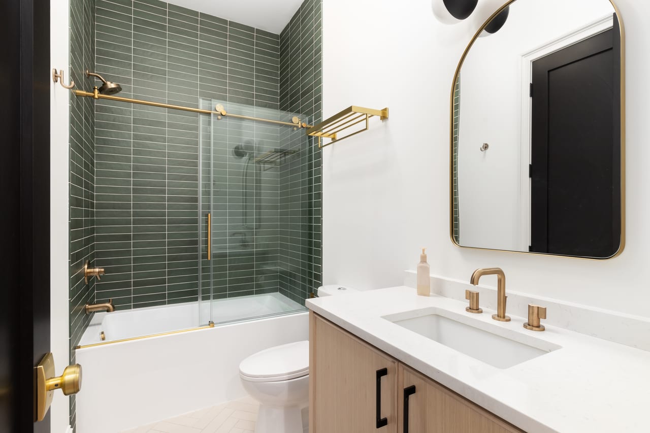 Modern frameless shower glass door with sleek hardware installed in Indian Trail, NC